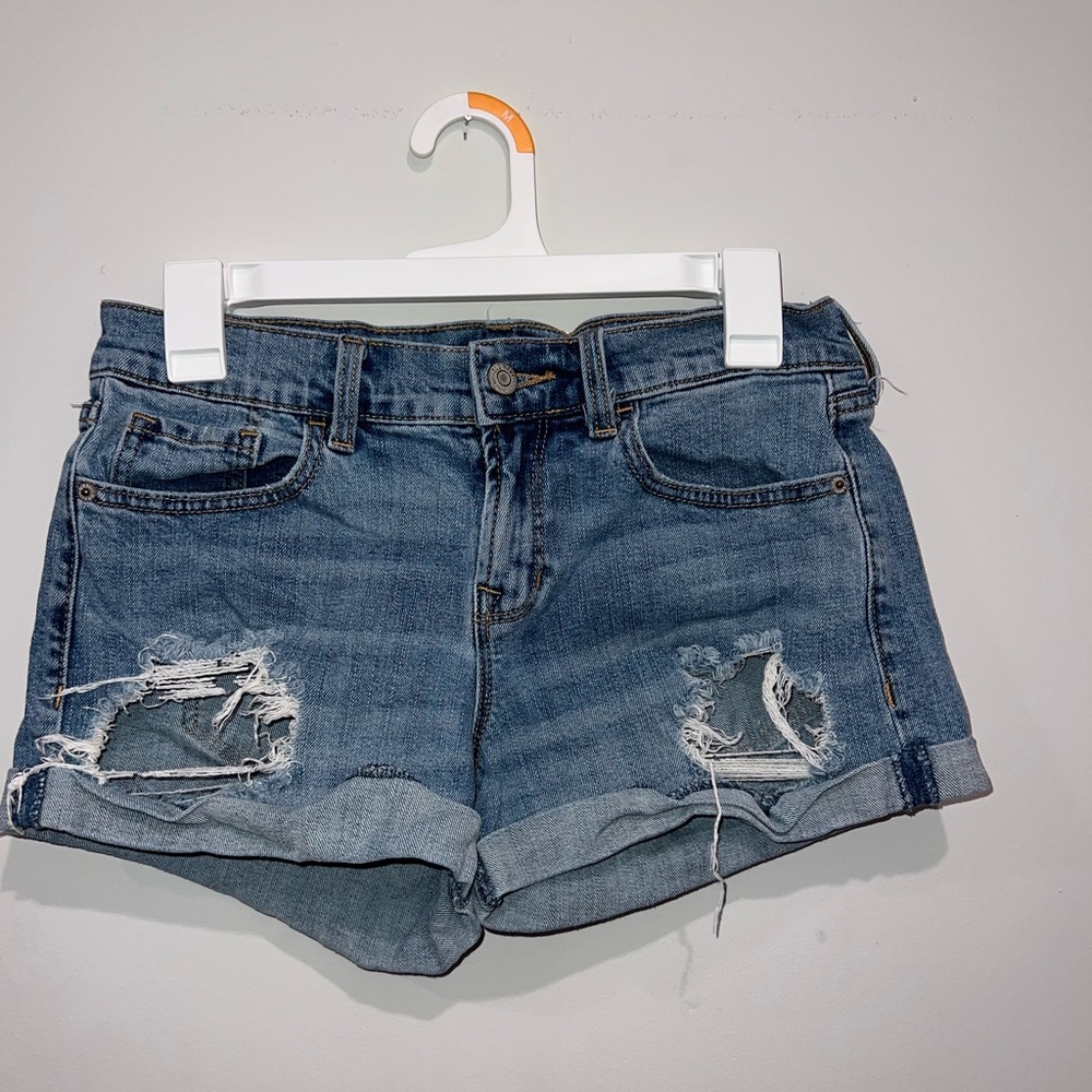 Old Navy blue jean shorts. Size 4, worn frequently. Tag on the back is faded.